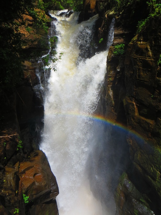 One of many falls on the lower trail with a bright rainbow
